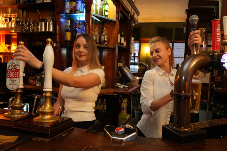 Bar staff pouring pints at The Stag’s Head