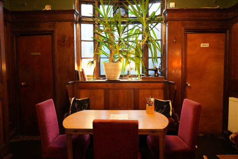 Dining table by the window in the panelled lounge