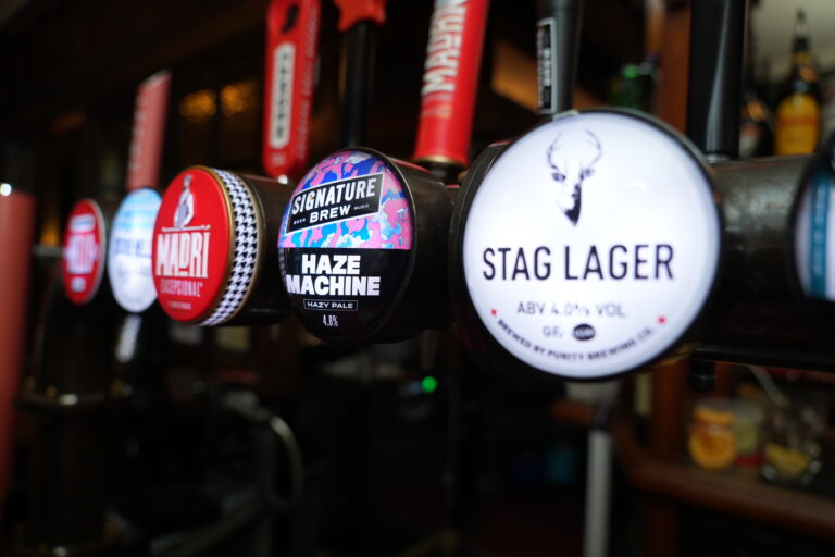 Beer taps, including Stag Lager, at the bar