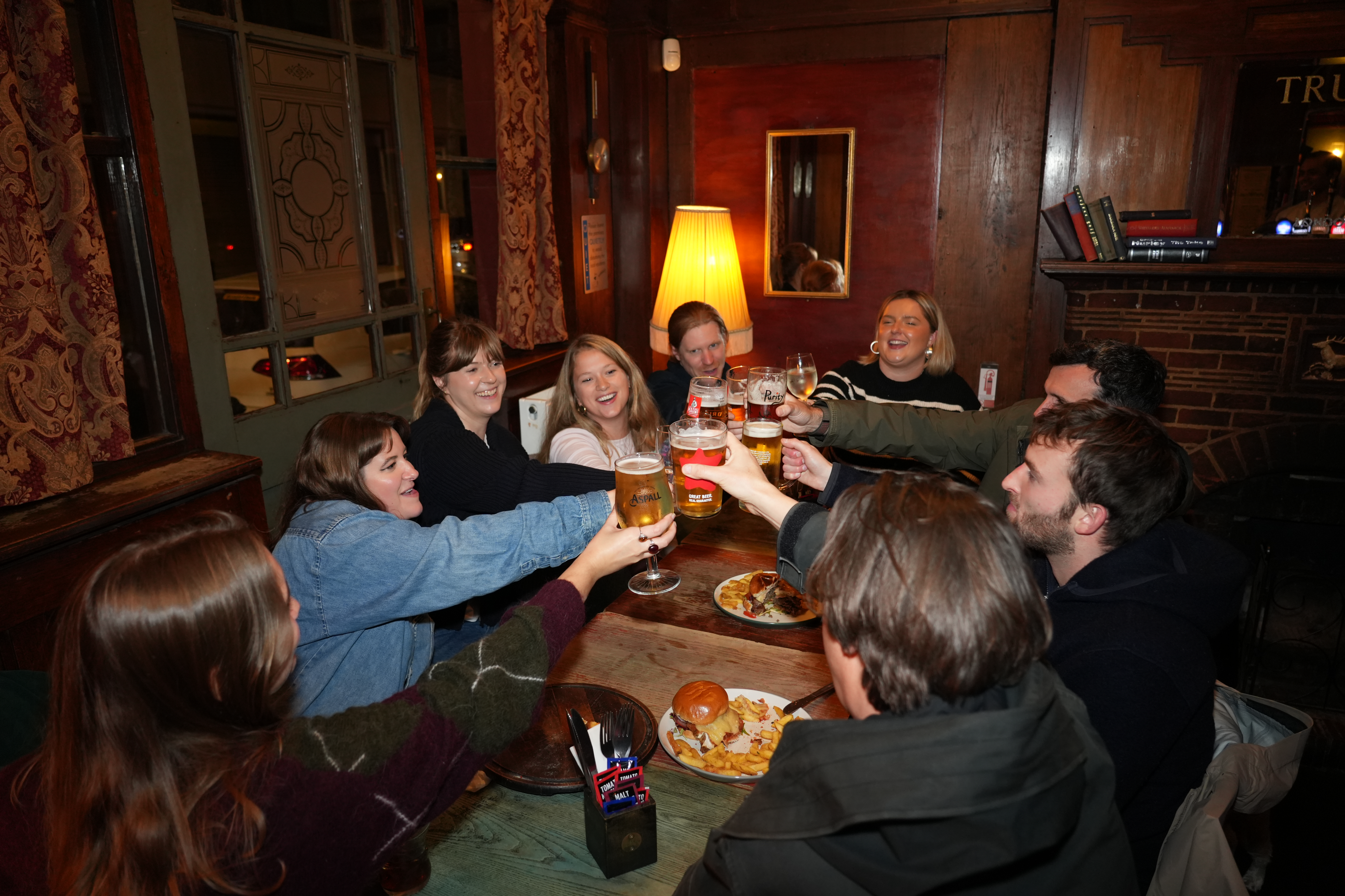 Friends enjoying food and drinks at The Stag's Head